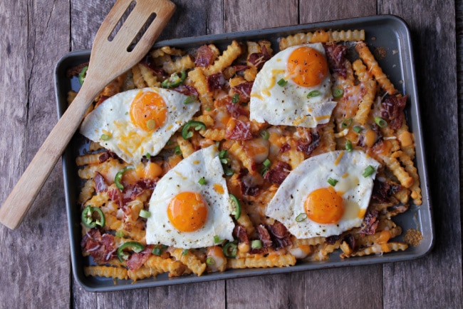 Fries with over easy eggs on top